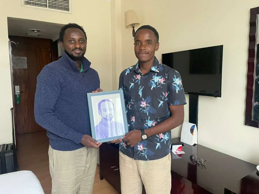 Handing a finished, framed portrait to the person it was made for
